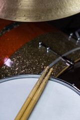 Obraz premium Closeup of drumsticks lying on the professional drum set. Drummer equipment. 