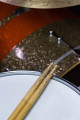 Closeup of drumsticks lying on the professional drum set. Drummer equipment. 