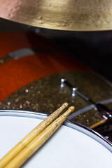Closeup of drumsticks lying on the professional drum set. Drummer equipment. 