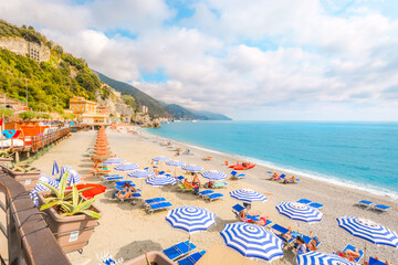 The sea and sandy beach Spiaggia di Fegina at the Cinque Terre Italy resort village of Monterosso...