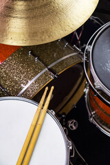 Obraz premium Closeup of drumsticks lying on the professional drum set. Drummer equipment. 
