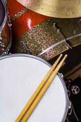 Closeup of drumsticks lying on the professional drum set. Drummer equipment. 