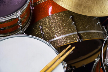 Closeup of drumsticks lying on the professional drum set. Drummer equipment. 