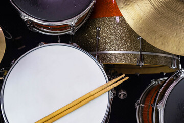 Closeup of drumsticks lying on the professional drum set. Drummer equipment. 