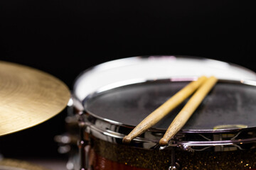 Closeup of drumsticks lying on the professional drum set. Drummer equipment. 