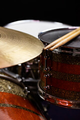 Obraz premium Closeup of drumsticks lying on the professional drum set. Drummer equipment. 