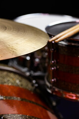 Closeup of drumsticks lying on the professional drum set. Drummer equipment. 
