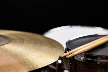 Obraz premium Closeup of drumsticks lying on the professional drum set. Drummer equipment. 