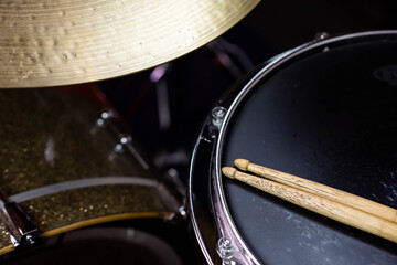 Closeup of drumsticks lying on the professional drum set. Drummer equipment. 