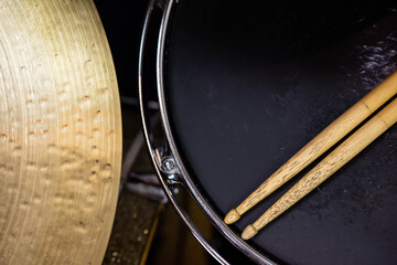 Closeup of drumsticks lying on the professional drum set. Drummer equipment. 