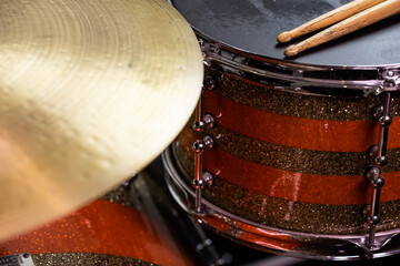 Closeup of drumsticks lying on the professional drum set. Drummer equipment. 