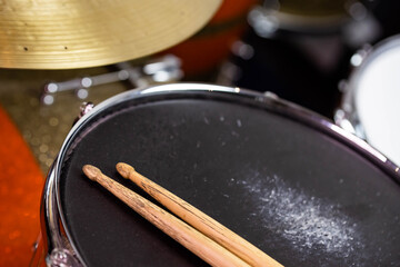 Closeup of drumsticks lying on the professional drum set. Drummer equipment. 