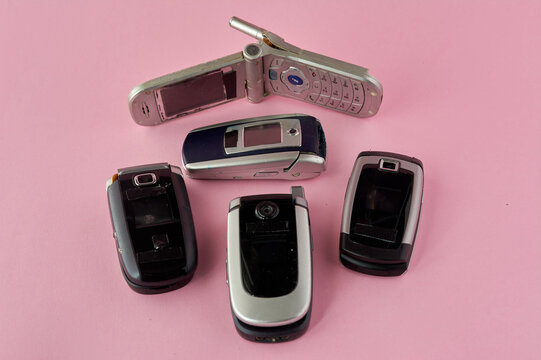 Broken Mobile Phones Recycling Technology Early 00s On Pink Background And Copy Space Stock Photo Adobe Stock Broken Mobile Phones Recycling Technology Early 00s On Pink Background And Copy Space Stock Photo Adobe Stock