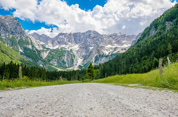 Low angle view of gravel road in amazing mountain valley. Jezersko, Slovenia.