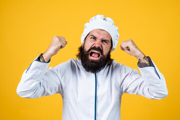 unfriendly look. angry man shouting. concept of housekeeping. mature bearded man wear chef hat. male cook ready for preparing food. brutal hipster in apron going to be cooking meal. time for eating