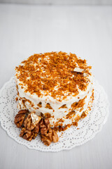 Homemade cake with honey and walnuts on a light background