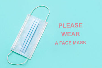 Fototapeta na wymiar medical face mask with warning 