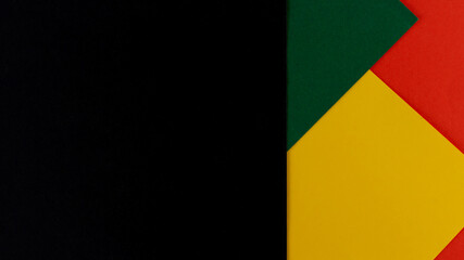 February Black History Month. Abstract Paper geometric black, red, yellow, green background. Copy space, place for your text.