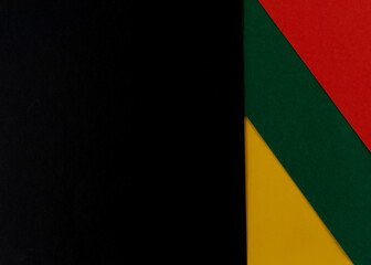 February Black History Month. Abstract Paper geometric black, red, yellow, green background. Copy space, place for your text.