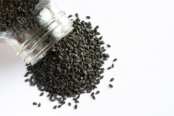 Black Sesame Seeds Spilled from a Jar