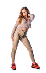 Beautiful young woman posing in modern studio