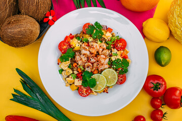 healthy food, salad with shrimps and vegetables with rice on a decorated table