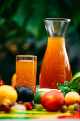refreshing lemonade with fruits and berries on a decorated table