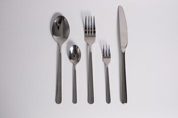 set of knives, spoons and forks isolated on a white background