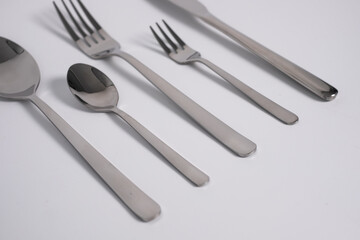 set of knives, spoons and forks isolated on a white background