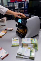 Euro € 50 bills being counted on a electronic machine