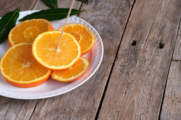 Sliced orange on a white plate