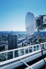 Construction for 5G broadband cellular network transmitters, telecommunication tower, wireless communication concept, clear blue sky background with copy space