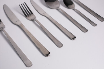 set of knives, spoons and forks isolated on a white background