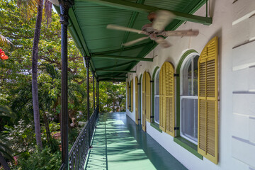 Porch of wooden house in spanish colonial style with a porch. Wooden district of Key West, Florida.