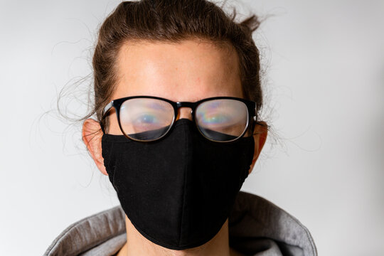 Young Man With Foggy Glasses Caused By Wearing Protective Face Mask. Protective Measure During Coronavirus Pandemic