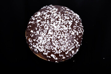 round donut with chocolate and sugar. Fat Thursday
