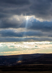a ray of sunshine through the clouds