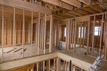 Fototapeta premium New home construction framing of a house under construction