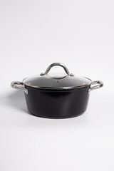 Stainless steel stewpot on white background