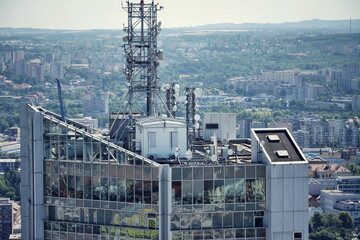Construction for 5G broadband cellular network transmitters, telecommunication tower, wireless communication concept, clear blue sky background with copy space