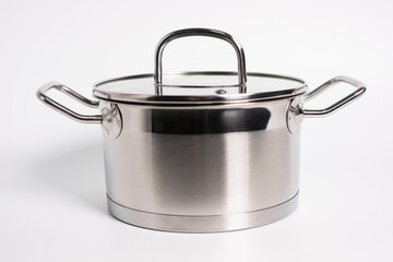 Stainless steel stewpot on white background
