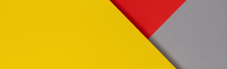 Creative abstract yellow, red and gray color geometric paper compositon background, top view