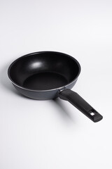 black frying pan isolated on a white background