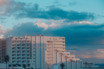 buildings in the city. Beautiful white clouds and blue sky