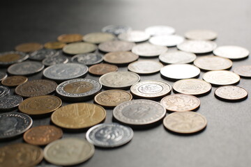 Many coins on a black background