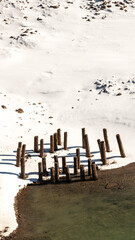 The importance of pier support;  a rotting pier in a winter landscape