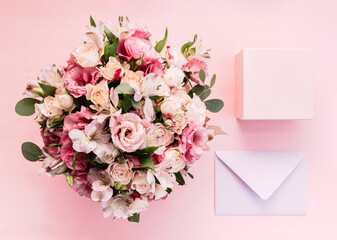 Top view, bouquet with flowers, present box, envelope.
