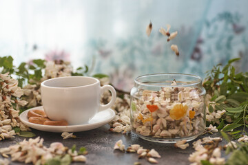 Cup of coffeel and acacia closeup. Nutrition. background with a cup of Coffee and acacia flowers.