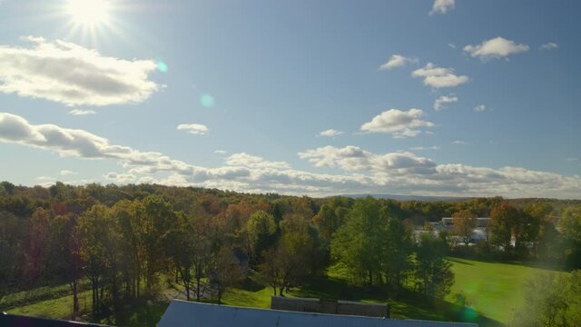 Lowering Aerial Shot from a Forest to a Vintage House and Barn