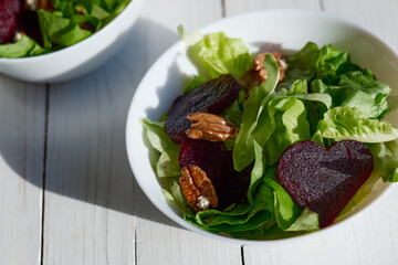 Vegan salad with lettuce, red beet and pecan nuts. Healthy Food. Diet. Healthy lifestyle concept. Cooking At Home